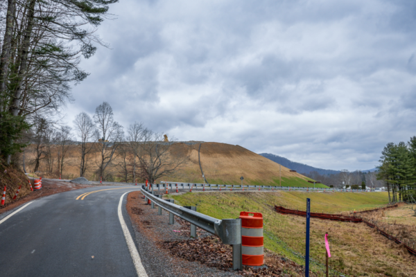 Corridor H construction in Holly Meadows, West Virginia, shows a barren mountain and construction cones.