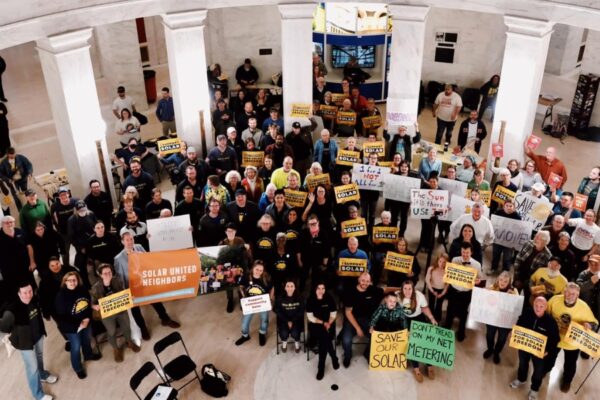 Attendees at the Save Our Solar Rally gather in the Rotunda at the West Virginia State Capitol building in Charleston